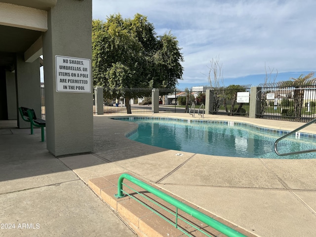 5839 E Norwood St, Mesa, AZ 85215 - community pool featuring a patio and fence