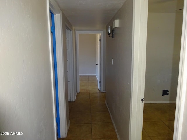 3171 W Orchid Ln, Phoenix, AZ 85051 - hall with tile patterned floors and baseboards