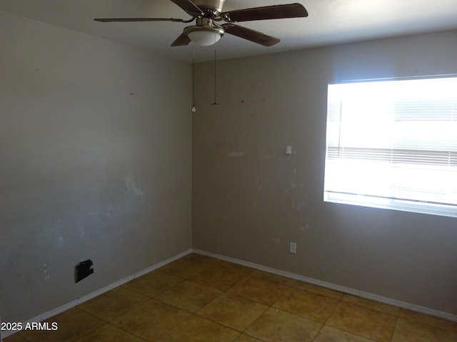 3171 W Orchid Ln, Phoenix, AZ 85051 - spare room featuring ceiling fan, baseboards, and tile patterned flooring