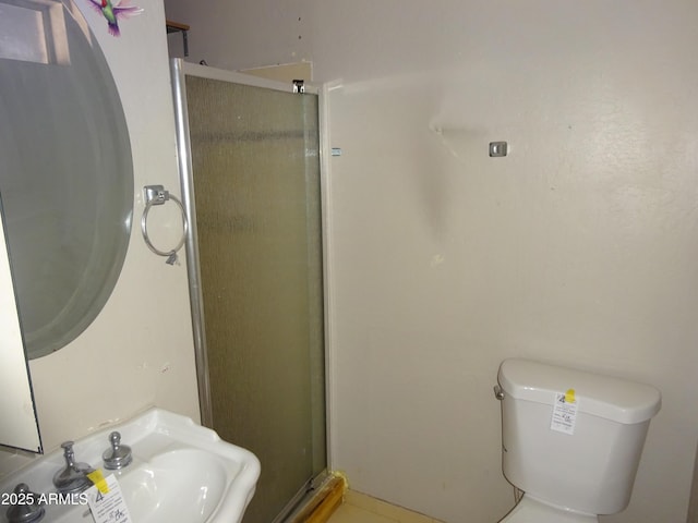 3171 W Orchid Ln, Phoenix, AZ 85051 - bathroom featuring a stall shower, a sink, and toilet