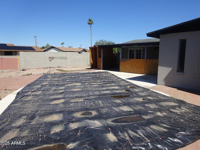 3171 W Orchid Ln, Phoenix, AZ 85051 - exterior view of fence and brick siding