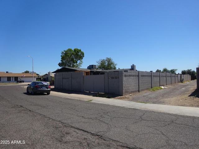 3171 W Orchid Ln, Phoenix, AZ 85051 - view of asphalt street featuring street lighting and sidewalks