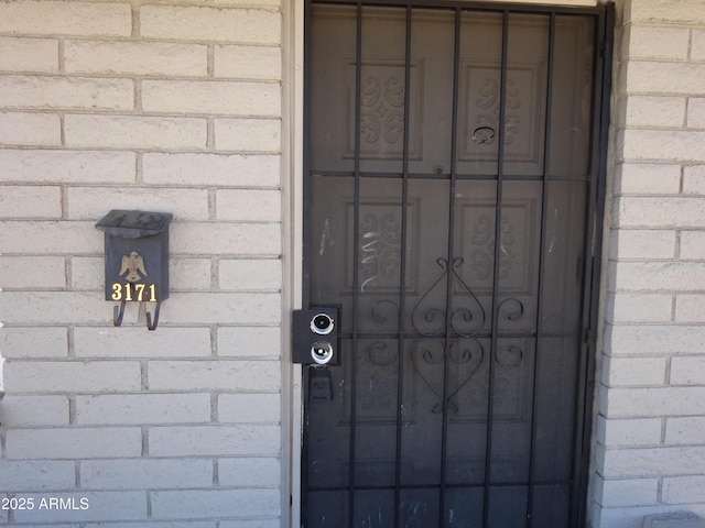 3171 W Orchid Ln, Phoenix, AZ 85051 - doorway to property with brick siding