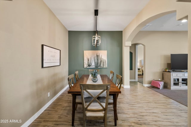 dining room with hardwood / wood-style flooring