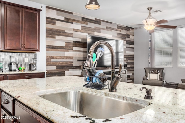 291 N Scott Dr, Chandler, AZ 85225 - kitchen with tasteful backsplash, a sink, light stone counters, visible vents, and a ceiling fan