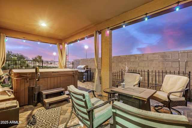 291 N Scott Dr, Chandler, AZ 85225 - patio terrace at dusk featuring a fenced backyard, area for grilling, and a hot tub
