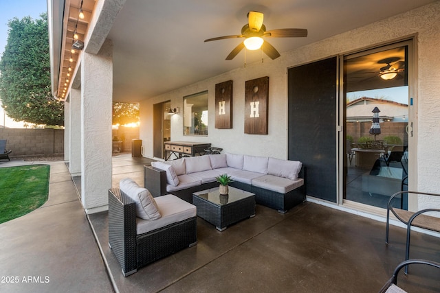 view of patio / terrace with fence, a ceiling fan, and outdoor lounge area
