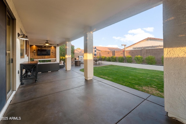 view of patio featuring a fenced backyard, a ceiling fan, and outdoor lounge area