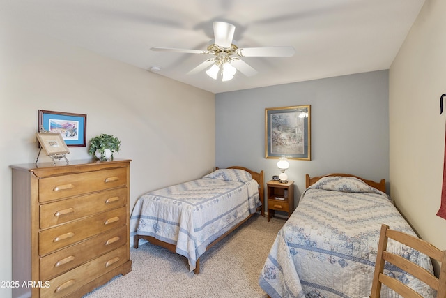 bedroom with light carpet and ceiling fan