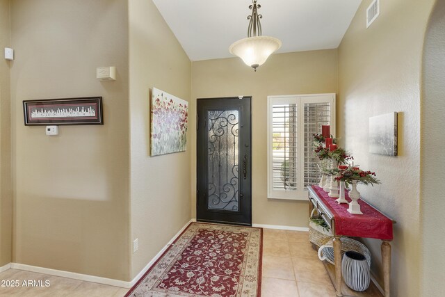 foyer featuring light tile patterned floors