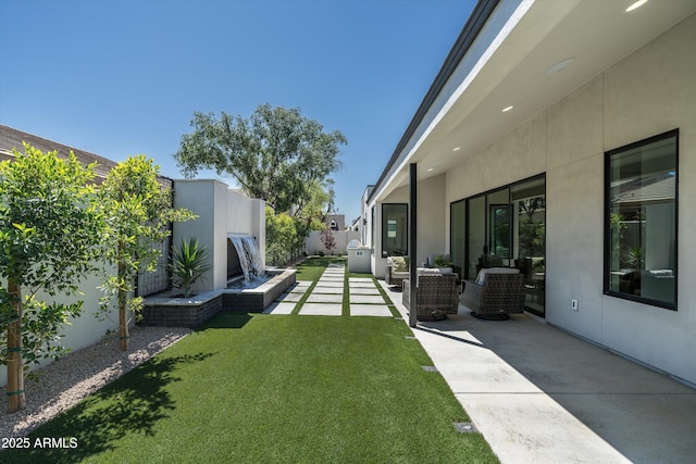 6329 N 10th Dr, Phoenix, AZ 85013 - view of yard with outdoor lounge area, a fenced backyard, and a patio area