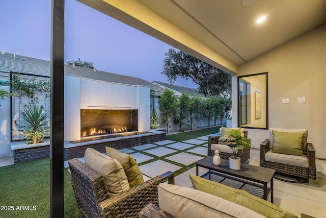 6329 N 10th Dr, Phoenix, AZ 85013 - view of patio / terrace with an outdoor living space with a fireplace