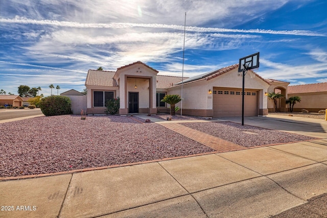 mediterranean / spanish home featuring a garage