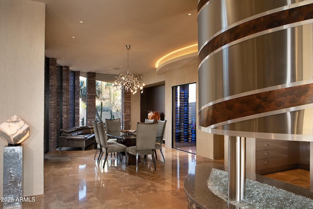 dining area with a chandelier and a towering ceiling