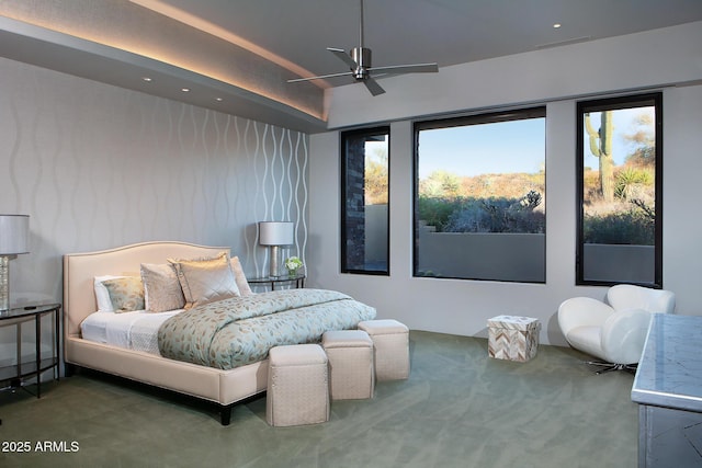 bedroom with ceiling fan and carpet floors