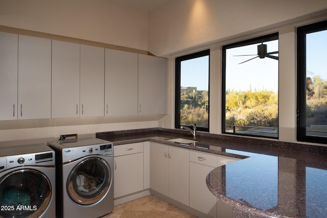 washroom with ceiling fan, sink, cabinets, separate washer and dryer, and light tile patterned floors