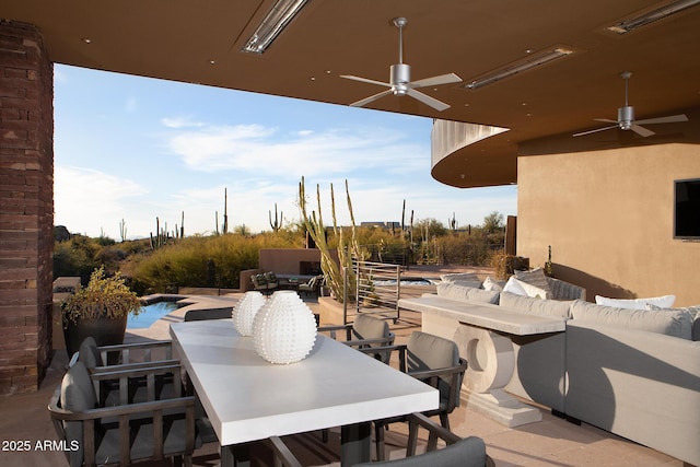 view of patio / terrace with an outdoor living space and ceiling fan