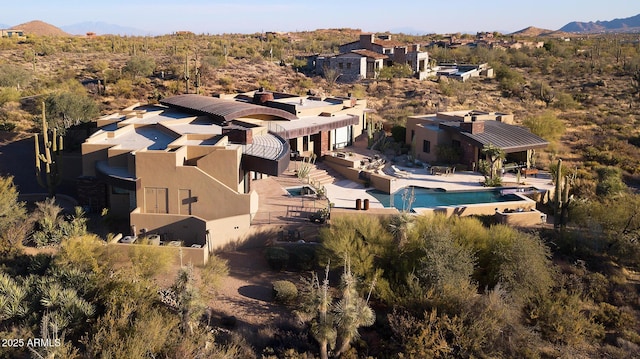 birds eye view of property featuring a mountain view