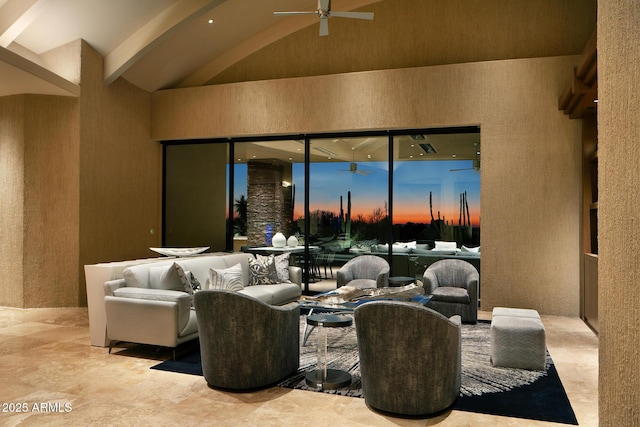 interior space featuring beamed ceiling, ceiling fan, and high vaulted ceiling