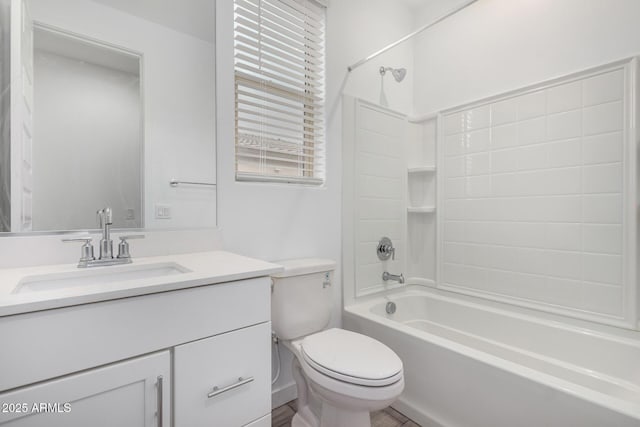 full bathroom featuring toilet, shower / bathing tub combination, and vanity