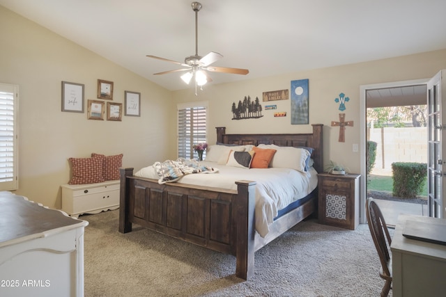 bedroom featuring light colored carpet, access to outside, lofted ceiling, and a ceiling fan
