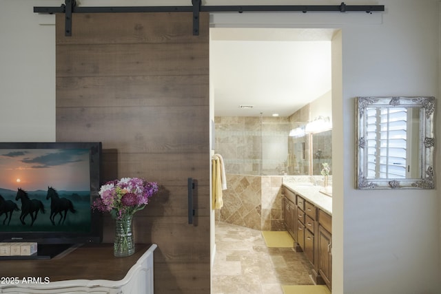 full bathroom with a walk in shower and vanity
