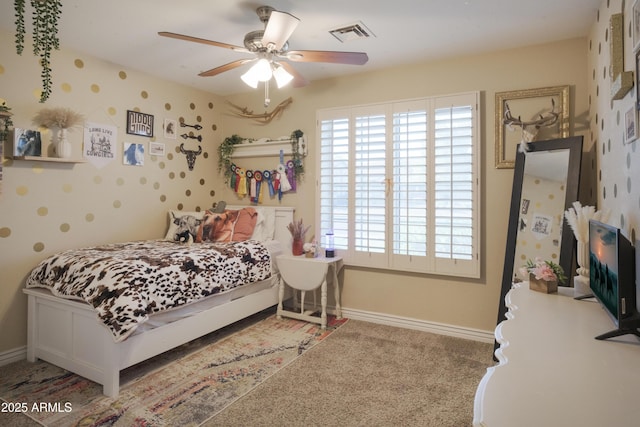 bedroom with baseboards, a ceiling fan, and carpet