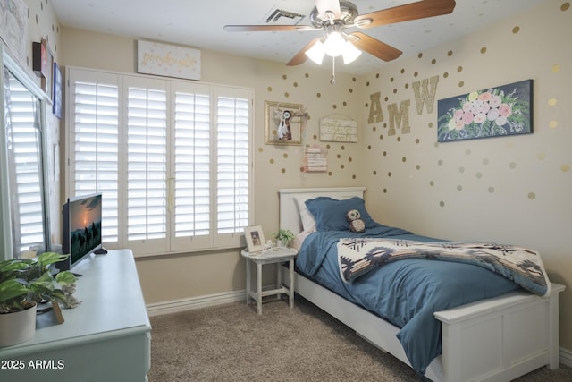 carpeted bedroom with baseboards and ceiling fan