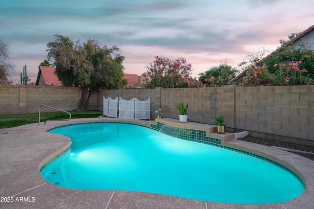 view of swimming pool featuring a fenced backyard