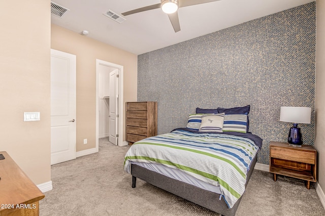 bedroom with light carpet and ceiling fan