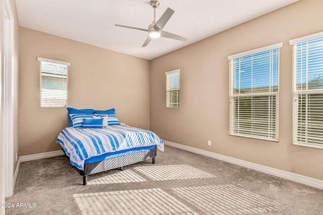 bedroom with ceiling fan and carpet floors