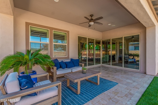 view of patio with an outdoor living space and ceiling fan