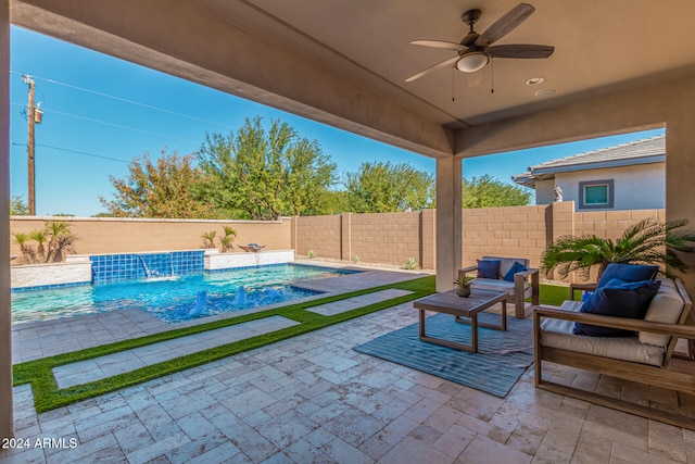 view of patio / terrace featuring an outdoor living space, pool water feature, a fenced in pool, and ceiling fan