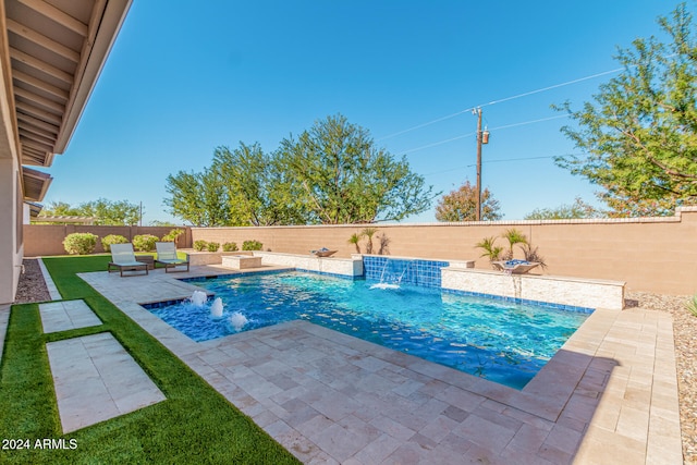 view of swimming pool with pool water feature