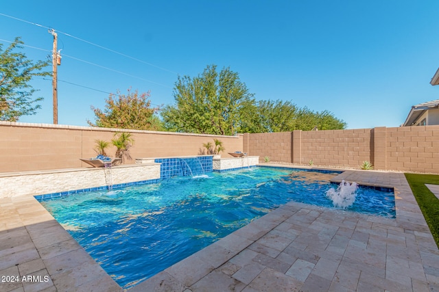 view of pool featuring pool water feature and a patio area