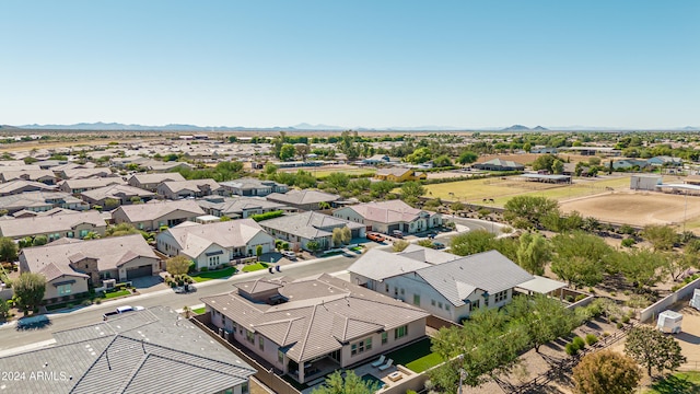 birds eye view of property with a mountain view