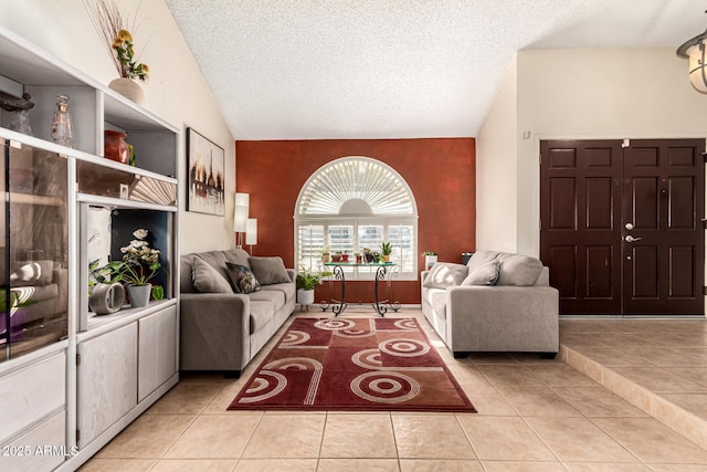 tiled living room featuring vaulted ceiling and a textured ceiling