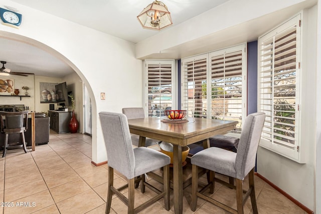 dining room featuring light tile patterned floors and ceiling fan