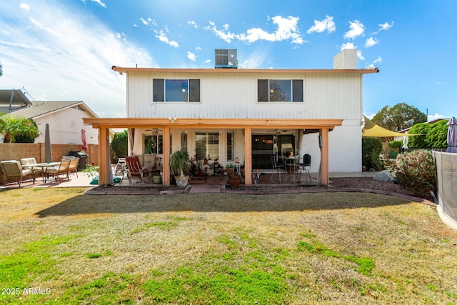 back of house with a patio, a yard, ceiling fan, and central air condition unit