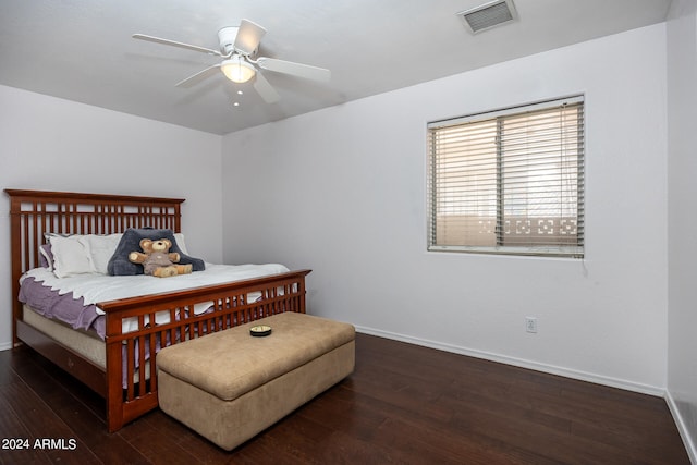 bedroom featuring dark hardwood / wood-style flooring and ceiling fan