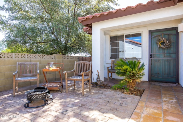 view of patio / terrace featuring an outdoor fire pit