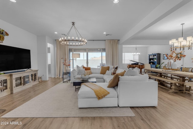 living room with recessed lighting, a notable chandelier, wood finished floors, and visible vents