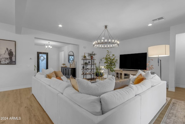 living area with visible vents, baseboards, a chandelier, light wood-type flooring, and recessed lighting