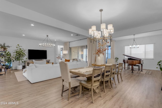 dining space with a notable chandelier, recessed lighting, a healthy amount of sunlight, and light wood-style floors