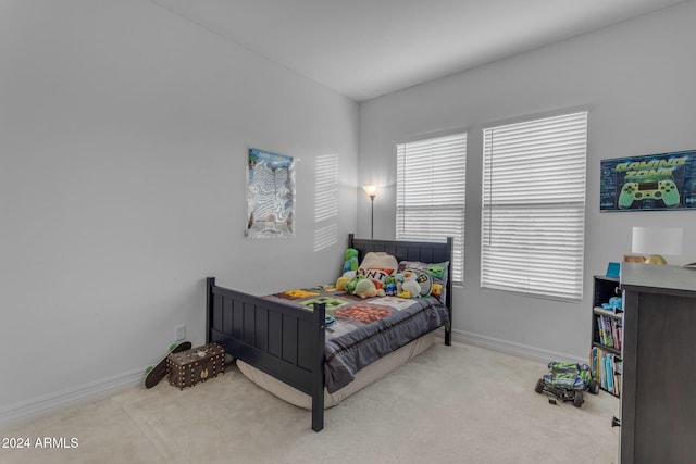 carpeted bedroom with baseboards