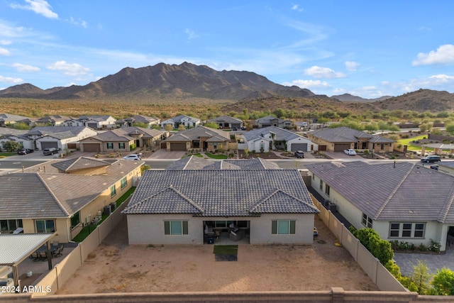 birds eye view of property featuring a mountain view and a residential view