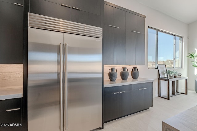 kitchen featuring stainless steel built in refrigerator