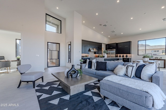 living room featuring a high ceiling