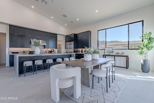 dining space with vaulted ceiling