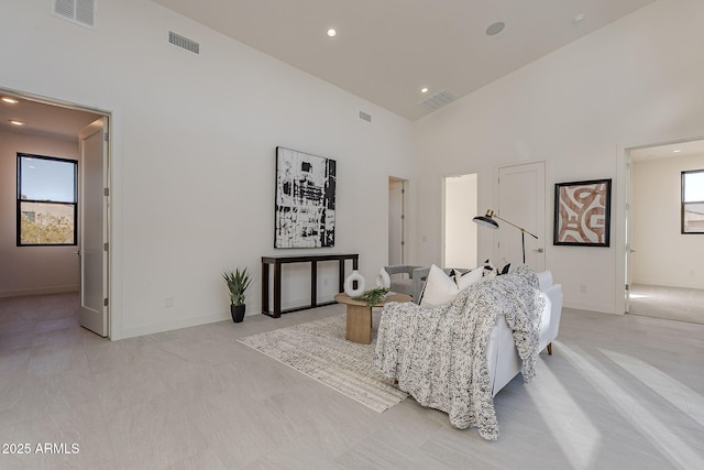 living room featuring high vaulted ceiling